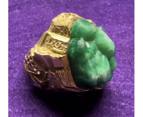 A French Brutalist ring. Set with a large piece of green moulded glass, with gold flecks, in the form of a crystal cluster, i