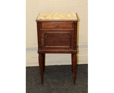 Mercier, an early 20th century French marble top night commode, fitted frieze drawer over cupboard, on turned fluted supports