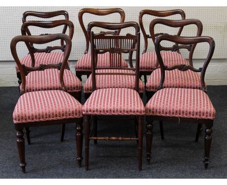 A harlequin set of eight Victorian rosewood dining chairs, each having serpentine rail, carved horizontal splat, overstuffed 