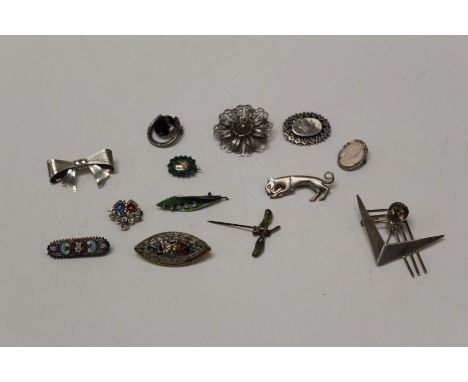 A collection of silver and white metal brooches to include filigree, micro mosaic, a plique a jour pin, a Blue John brooch, c
