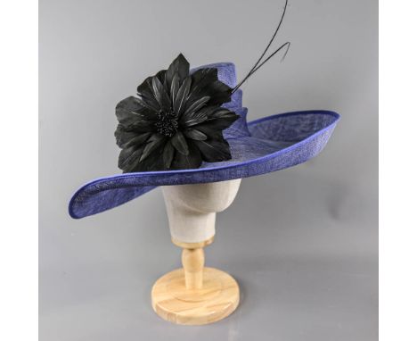 PETER BETTLEY LONDON - Blue occasion hat, with black feather flower and stick detail, internal circumference 55cm, brim width