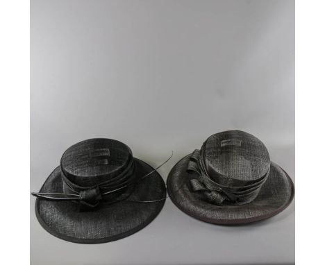 A HAT STUDIO DESIGN - 2 black occasion hats, one with knot and stick detail, the other with twirl and hatpin detail (2)

1 wi