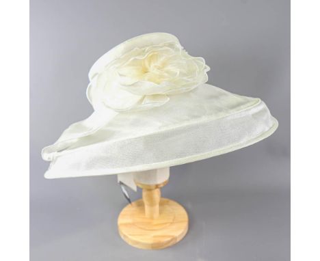 SUZANNE BENTTLEY LONDON - Light ivory organza occasion hat, with flower detail, internal circumference 55cm, brim width 16cm,