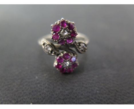A ruby and diamond twin cluster ring - size L, the central diamonds surrounded by seven small rubies each