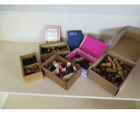 A collection of four vintage Chess sets to include Regence and a bone Egyptian pattern set and a draughts set