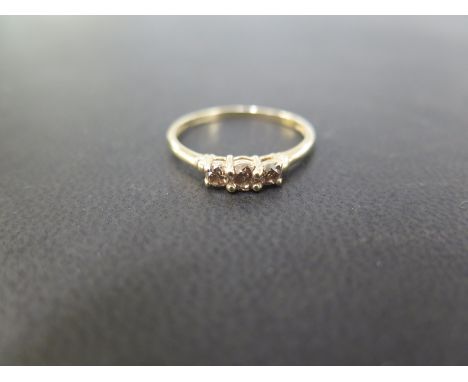 A 9ct gold 'cognac' diamond three-stone ring - Hallmarked Birmingham - Ring size T 1/2 - Weight approx 1.6gms
Condition Repor