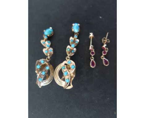 A pair of turquoise and 14ct yellow gold drop ear pendants and a pair of 9ct yellow gold and ruby ear pendants 
Condition rep