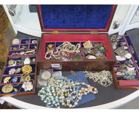 An assortment of silver, vintage and costume jewellery