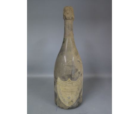 A 1976 Vintage bottle of Moet and Chandon Champagne Cuvee Dom Perignon - wine level 10mm below foil