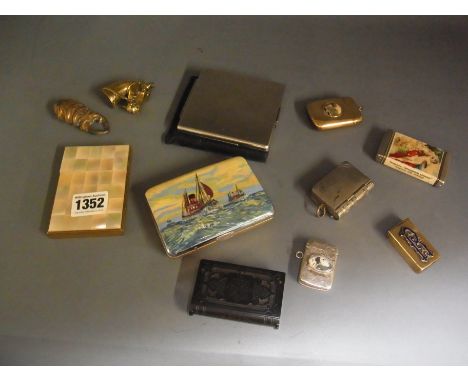 A silver vesta case picture of a Dalmation, a brass vesta case in the form of a horses head, a collection of three cigarette/