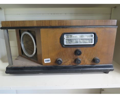 An Art Deco Clarkes Atlas A 758 walnut and chrome Valve Radio - Height 29cm x Width 58cm 
Condition report: This item is sold