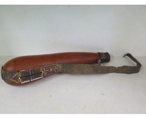 A vintage African water carrier - Length 55cm
Condition report: General wear, rip to leather 