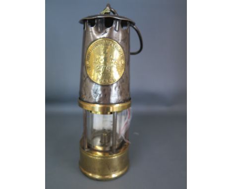 A brass Miners lamp bearing a label for The Projector Lamp and Lighting Co Ltd. type SL No. 278 Eccles - Height 24cm 