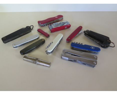 A collection of seven Swiss Army knives by Victorinox by Wenger - four other knives and a tool set