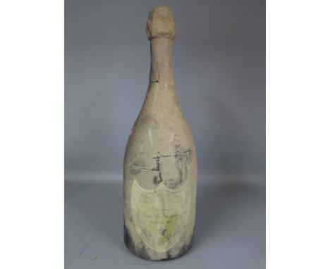 A 1975 Vintage bottle of Moet and Chandon Champagne Cuvee Dom Perignon - wine level 15mm below foil