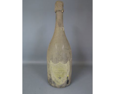 A 1975 Vintage bottle of Moet and Chandon Champagne Cuvee Dom Perignon - wine level 22mm below foil