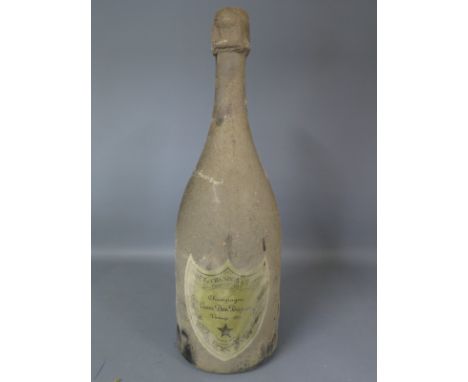 A 1975 Vintage bottle of Moet and Chandon Champagne Cuvee Dom Perignon - wine level 15mm below foil