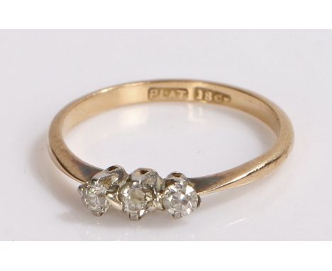 18 carat gold and diamond ring, the head with three platinum set diamonds, ring size J1/2, 1.5g