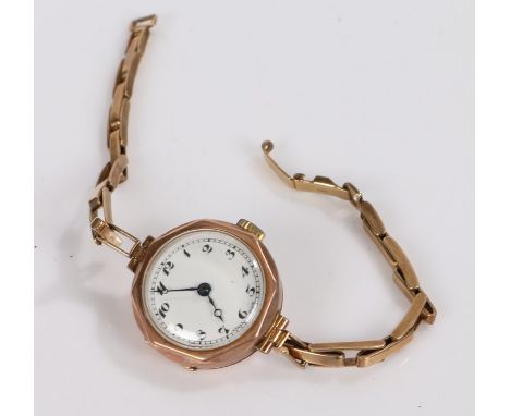 Ladies 9 carat gold wristwatch, the white dial with Arabic numerals, manual wound, on a 9 carat bracelet, 20g