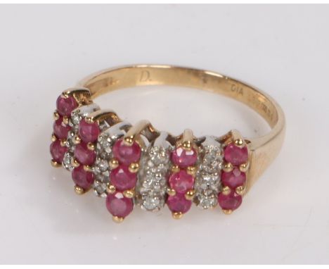9 carat gold ring set with diamonds and garnets, ring size K. 2.1g