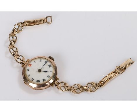 9 carat gold ladies wristwatch, the white dial with Roman numerals, manual wound, on a rolled gold bracelet, 17g