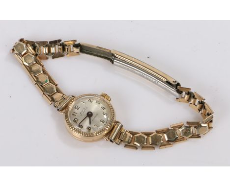 Avia 9 carat gold ladies wristwatch, the signed silver dial with Arabic numerals, manual wound, on a rolled gold bracelet, th