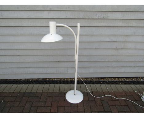 A Danish standard lamp in white with adjustable single light and metal shade 