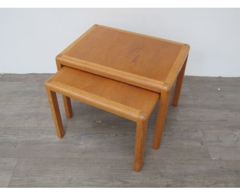 A nest of two light oak Danish coffee tables by Kai Kristiansen, largest 55cm x 38cm x 40cm tall 