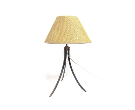 A Brass tripod table lamp with woven cane shade,   65cm high including shade 