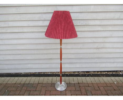 A Danish hardwood and Aluminium standard lamp with fluted shade. 146cm high including shade. 