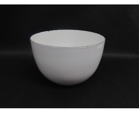 An Arabia of Finland white enamel ware bowl with original label remains to the base. 14cm high x 21cm diameter. (some chippin