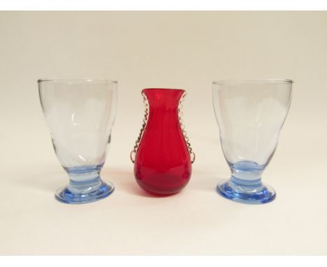 A Whitefriars ruby red glass vase cased in clear and two Whitefriars blue sapphire glasses. Tallest 12cm 