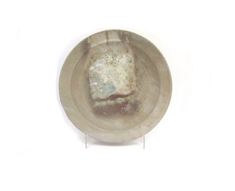 ROBIN WELCH (1936-2019): A Studio Pottery large charger with pale blue enamel droplets, mauve and ash glazes.  Stamped to und