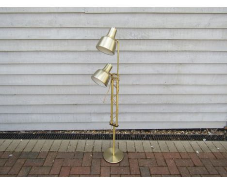A Danish brassed metal standard lamp with twin adjustable spots. 