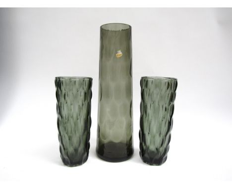 A Czech smoked glass tapering vase with moulded scale detail 31cm, plus a pair of similar smoked press - moulded vases.  20cm