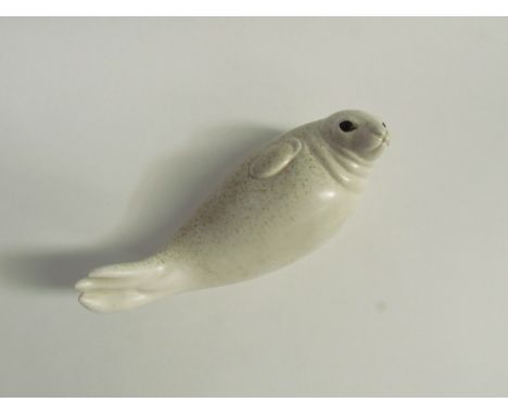 Paul Hoff for Gustavsberg - A ceramic figure of a Seal. Impressed marks to base. 9cm high x 24cm long 