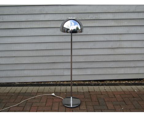 A Cosmo Designs chromed metal standard lamp, domed shade and label to underside.   126cm high 