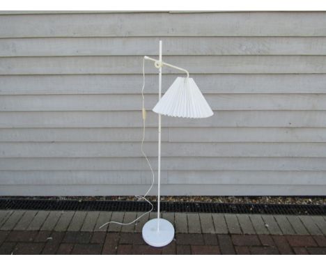 A Danish standard lamp in white with adjustable arm and fluted shade 