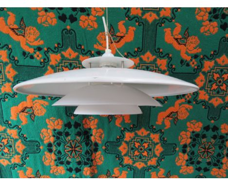 A Danish Poulsen style ceiling light of four tiers in white. Approx 43cm diameter 