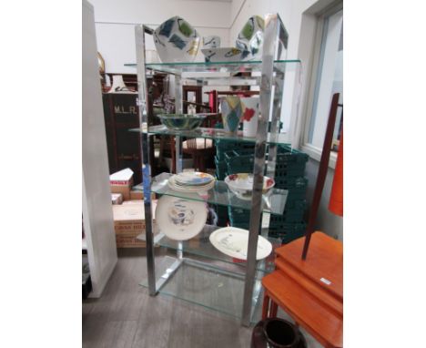 A late 20th Century chromed metal and glass open shelf display stand. 89cm x 40cm x 164cm high 