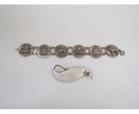 A Finn Jensen sterling enamel leaf form brooch (damage) and a six panel bracelet depicting moose, ship and building, stamped 