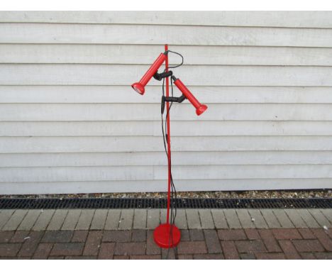 A Danish c1980's standard lamp in red with twin adjustable spots. 