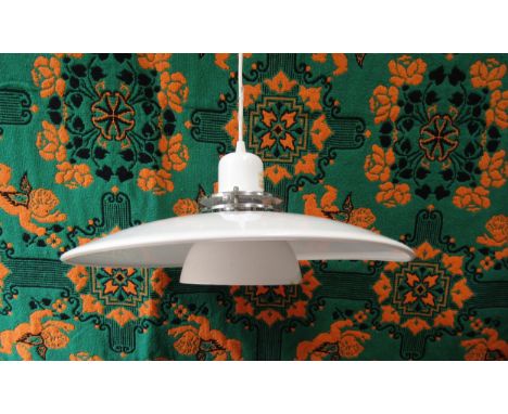 A Danish Poulsen style ceiling light of four tiers in white and chrome. Approx 43cm diameter 