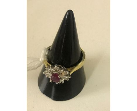 An 18ct ruby and diamond dress ring