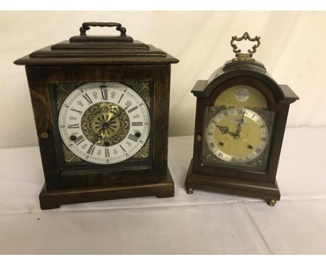 Two modern mantel clocks; a large one with Westminster chimes and the other striking on two bells
