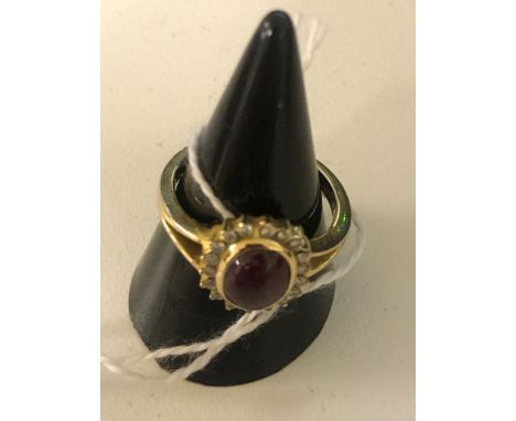 An 18ct cabochon ruby and diamond dress ring