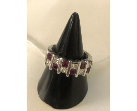 An 18ct princess cut ruby and diamond half eternity ring