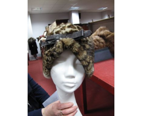 A c.1950's Christian Dior Fur Hat, with pleat front, trimmed with leather bow, labelled "Christian Dior, Licence Chapeau" pos