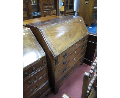 A Late XVIII Century Mahogany Bureau, with crossbanded fall front to fitted interior, above four long drawers on bracket feet
