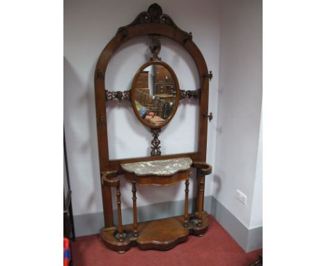 A XIX Century Oak Hall Stand, with applied scroll pediment to arched central mirror, the frame with turned hat pegs, pierced 